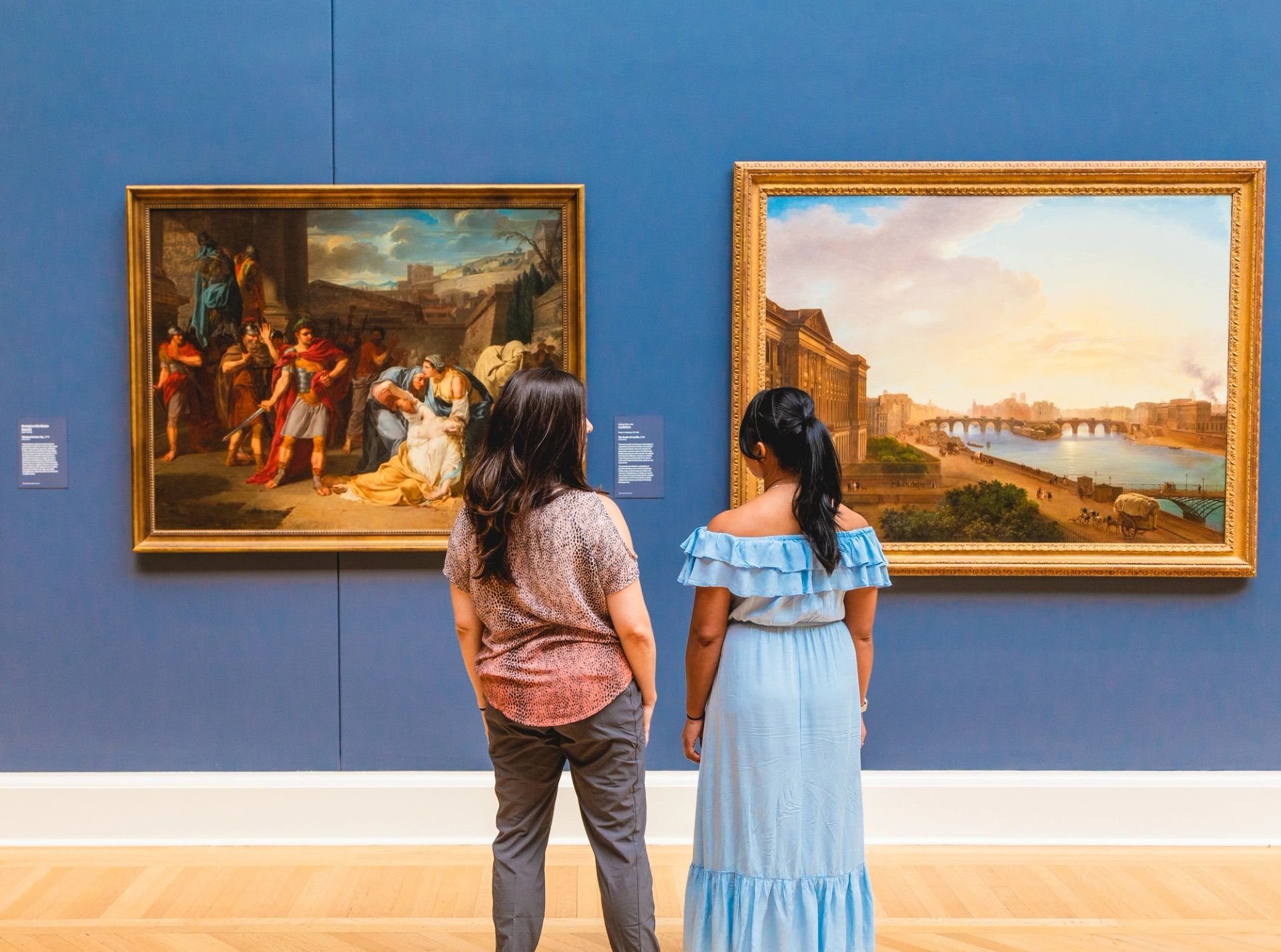 girls looking at art
